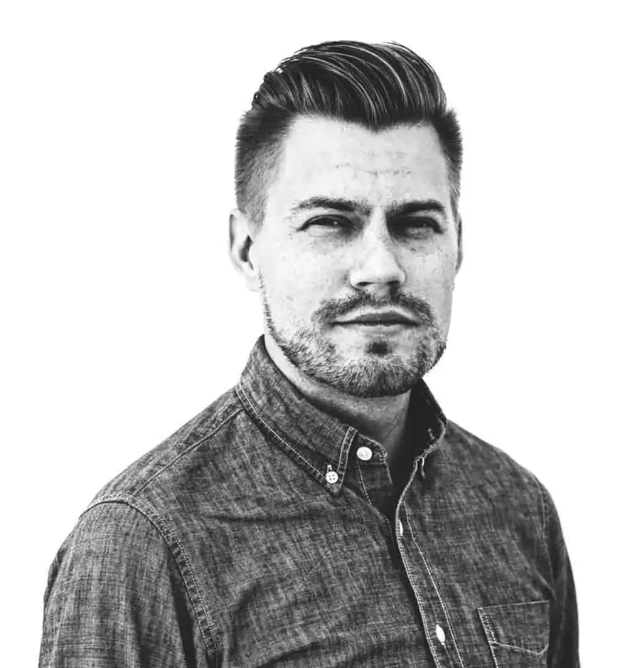 Black-and-white portrait of the site author looking to the side